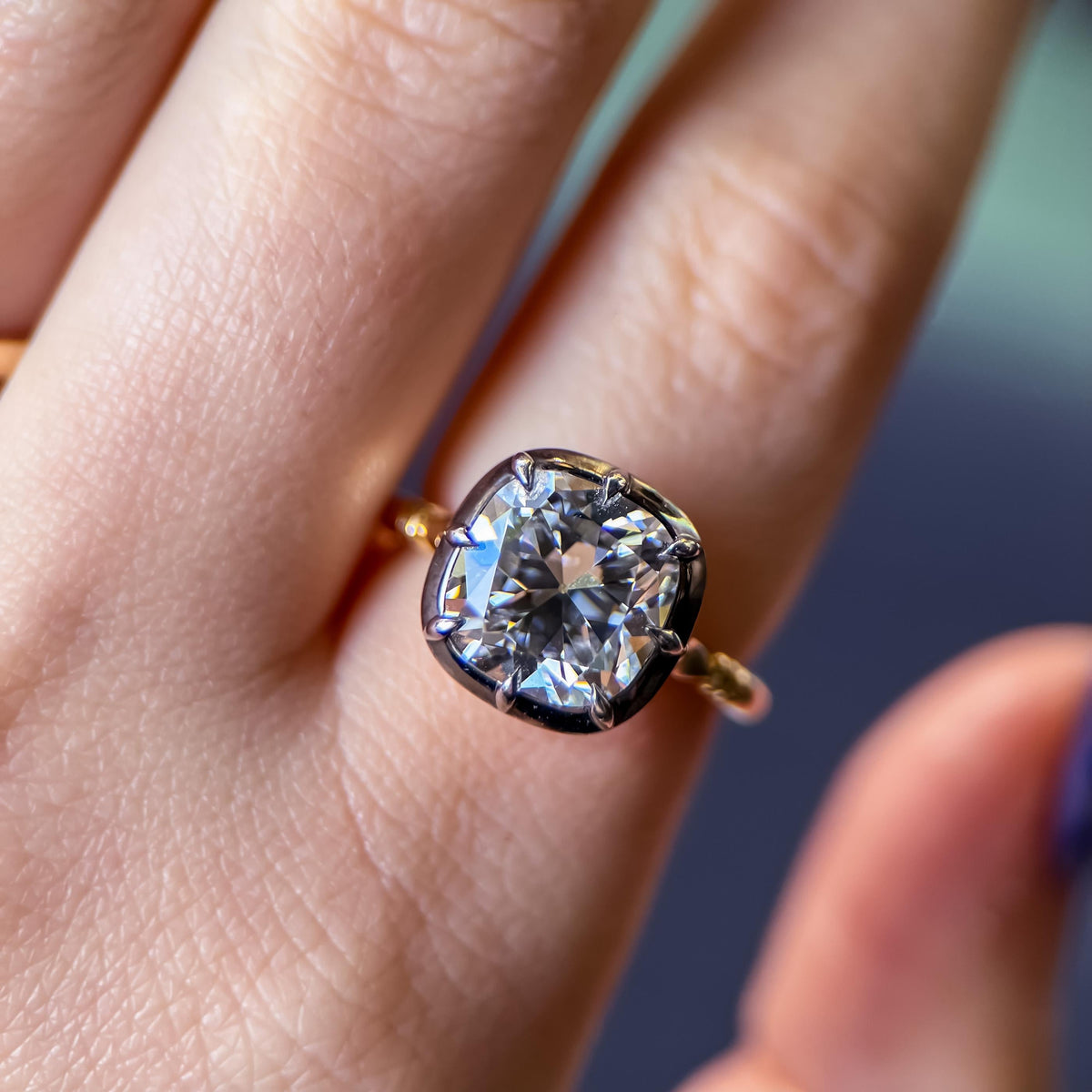 The Caroline ring: old mine cut lab-grown diamond in a blackened collet on a yellow gold snake shank, view 2