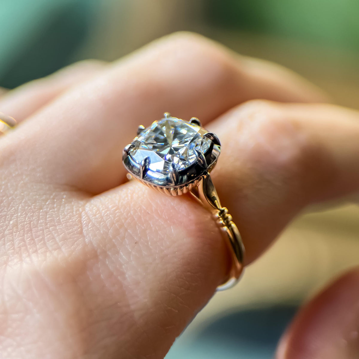 The Caroline ring: old mine cut lab-grown diamond in a blackened collet on a yellow gold snake shank, view 4