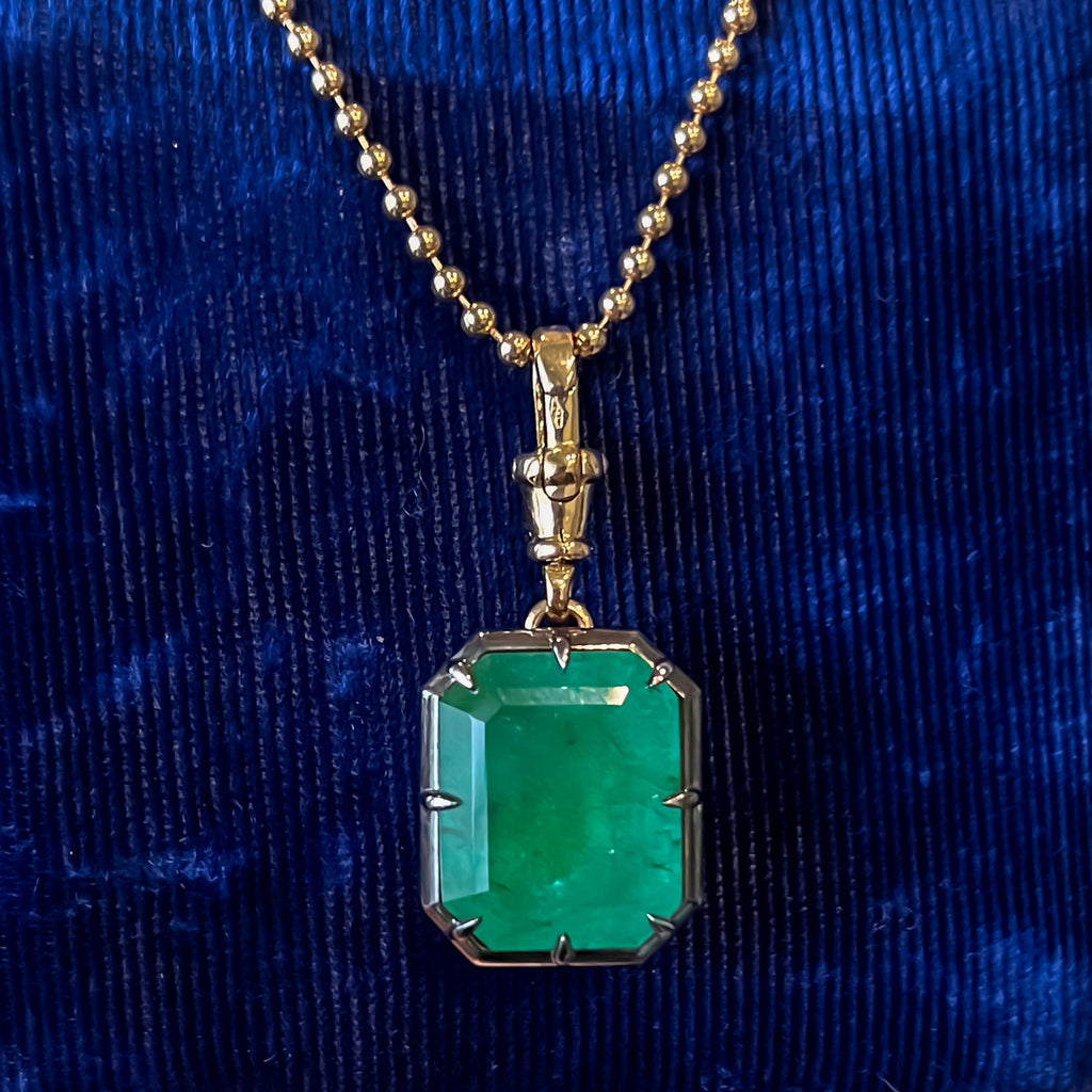 13.1 carat natural Zambian emerald pendant in 18K yellow gold and blackened platinum