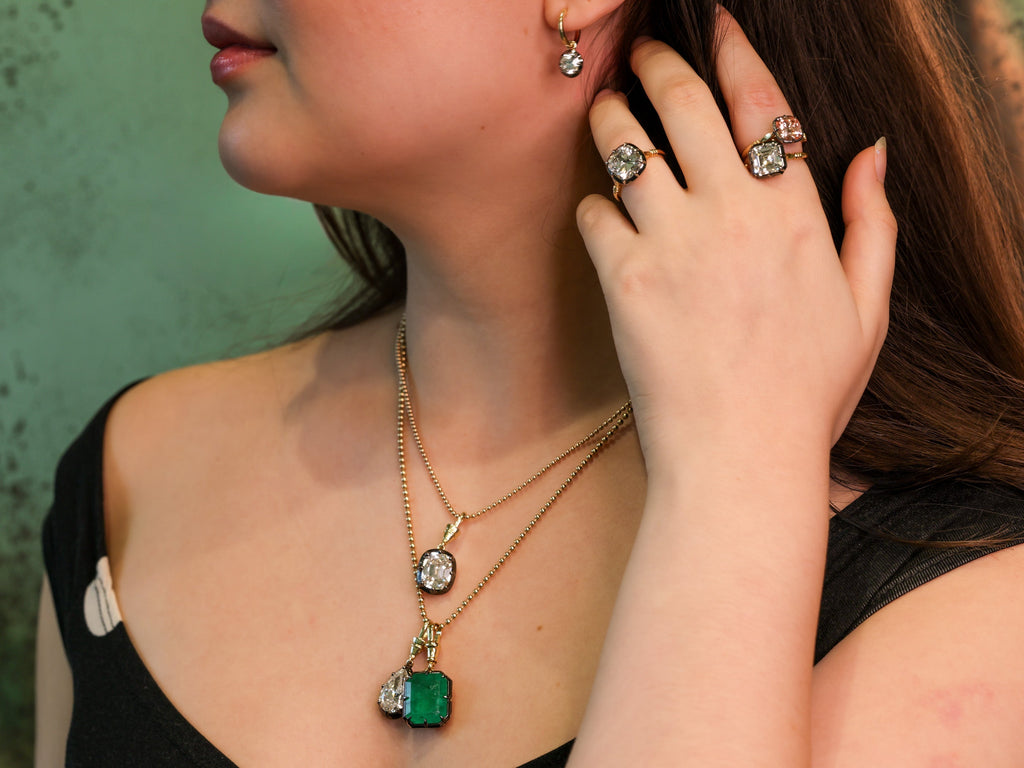 13.1 carat natural Zambian emerald pendant in 18K yellow gold and blackened platinum