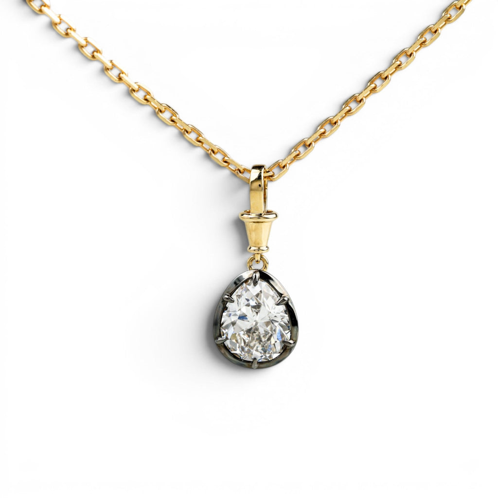 Antique pear cut lab-grown diamond collet pendant in yellow gold and blackened platinum