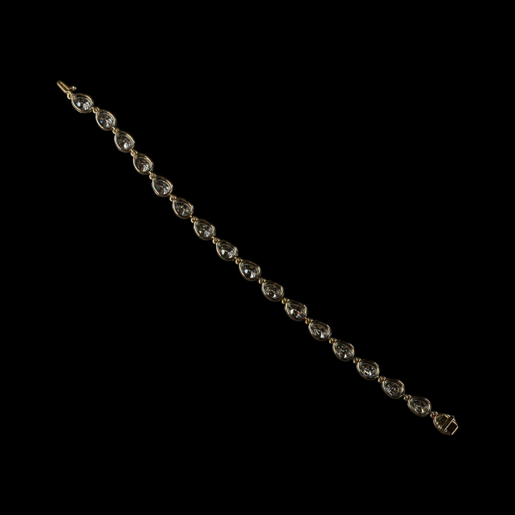 The Caroline Bracelet: collet-set antique pear cut lab-grown diamonds in blackened platinum over 18K yellow gold, view 3