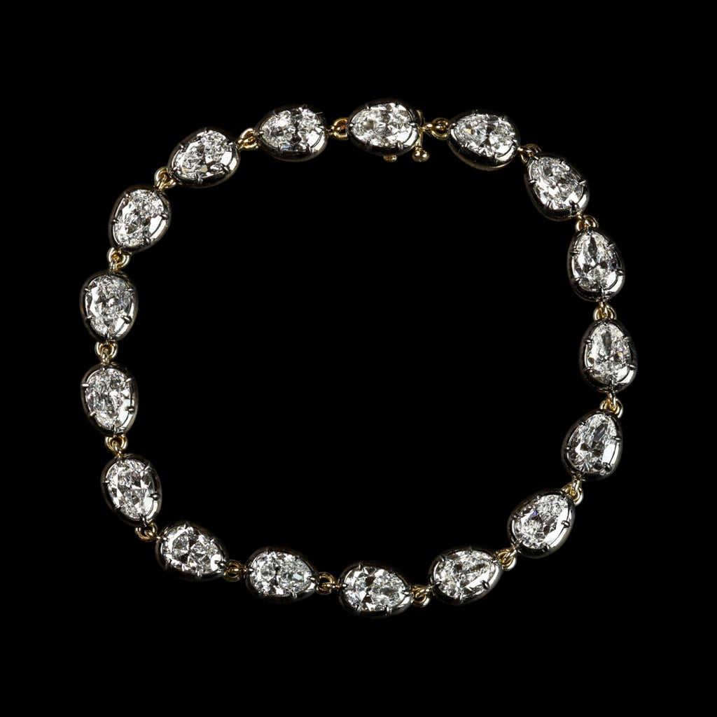 The Caroline Bracelet: collet-set antique pear cut lab-grown diamonds in blackened platinum over 18K yellow gold