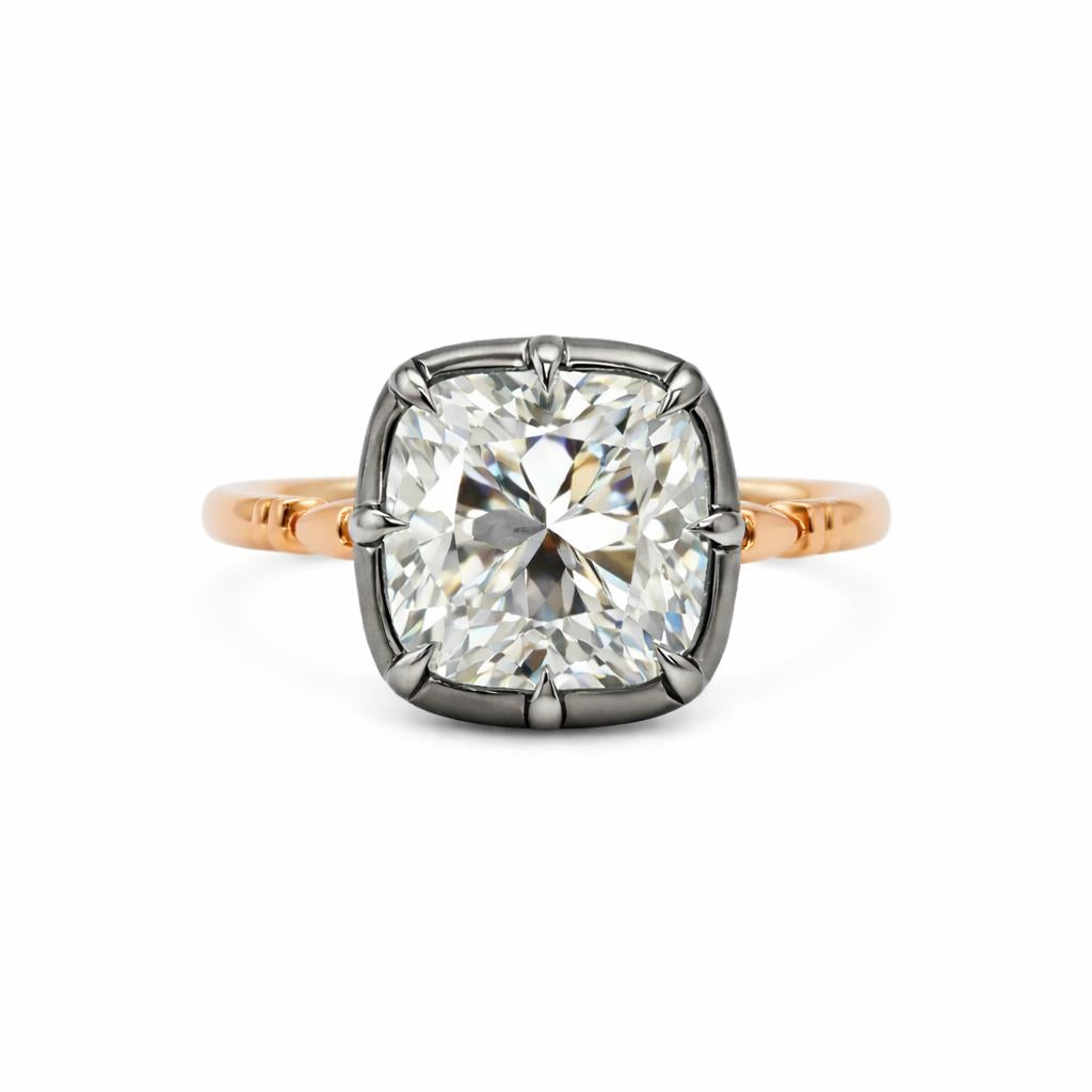 The Caroline ring: old mine cut lab-grown diamond in a blackened collet on a yellow gold snake shank