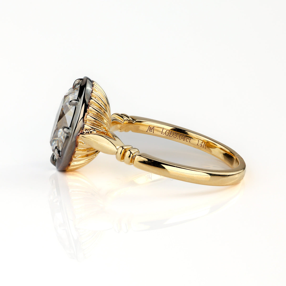 The Caroline ring: antique oval lab-grown diamond in a blackened collet on a yellow gold snake shank, view 2