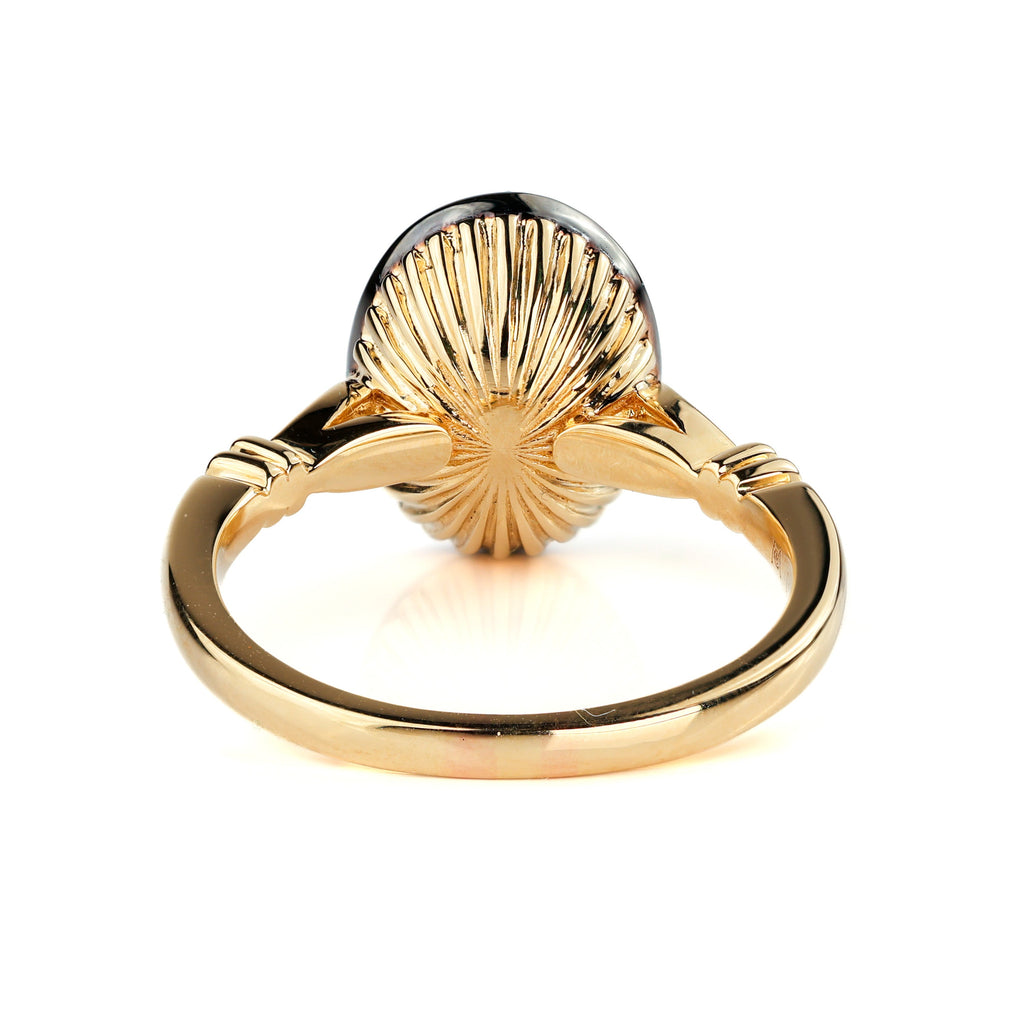 The Caroline ring: antique oval lab-grown diamond in a blackened collet on a yellow gold snake shank, view 5